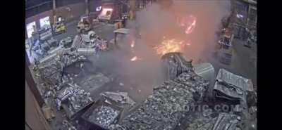 Extremely lucky forklift driver avoids molten metal bath. The cab and the mast protected him.