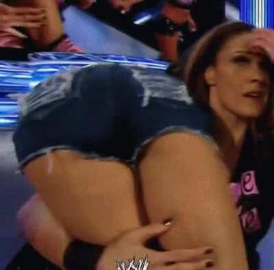 Tamina carrying AJ Lee to the back