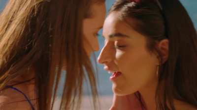 Emily & Stacy kissing in the pool