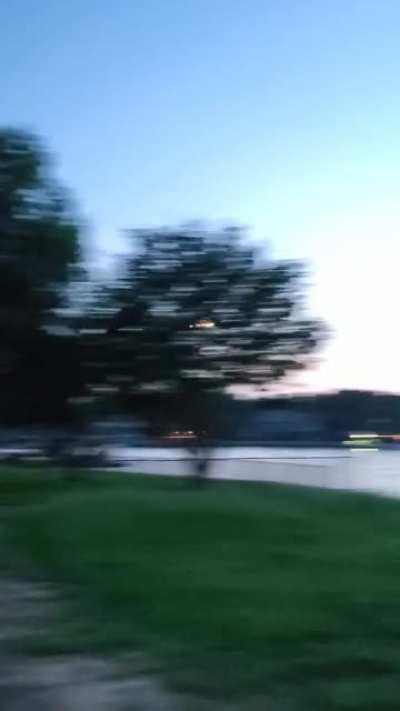 MiG-17 over a lake at twilight