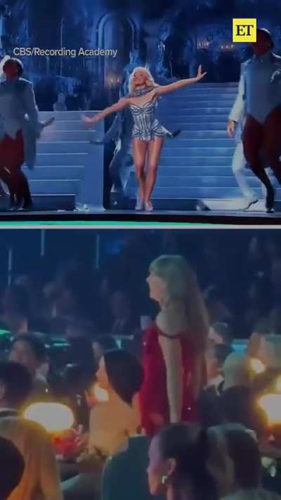 It looks like by this point she was hitting that bottle of wine pretty heavily. It appears someone behind her told her to move so they could see.