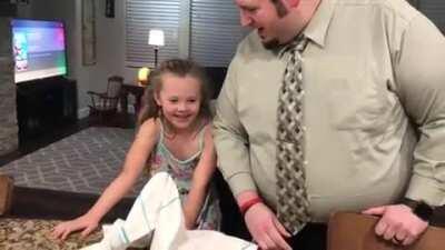 Dad tries to do water trick.