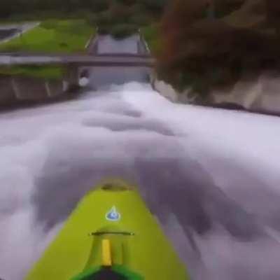 Riding down this steep stone wall on a canoe