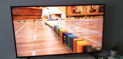 I am rewatching malcolm in the middle again and noticed the hand pushing the dominoes right after the US flag.