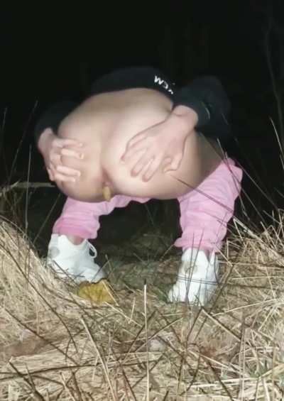 Shitting in the dark outside