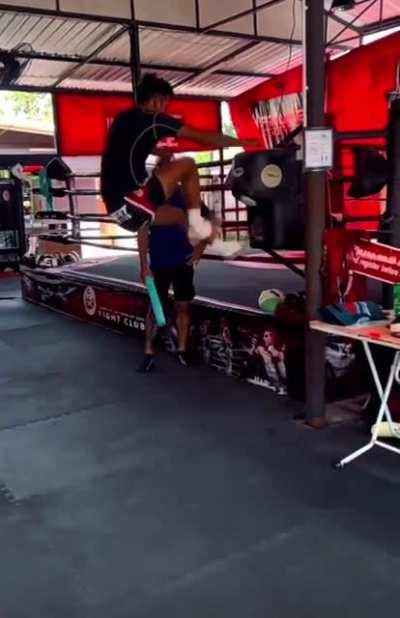 Thai dude practicing jumping knees and kicks in Phuket.