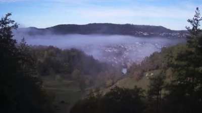Morning fog going away in a mountain town in Germany