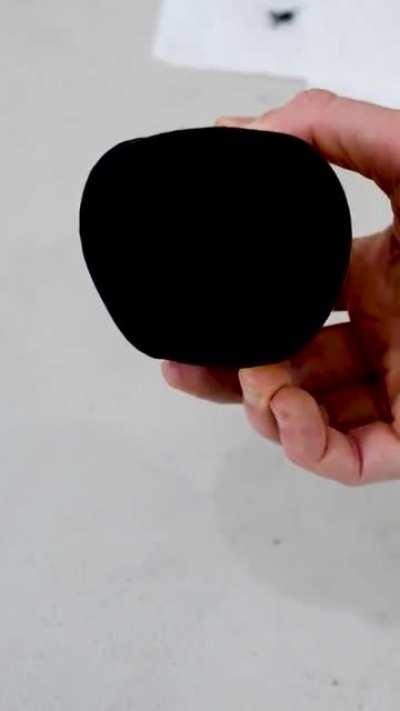 Apple painted with Musou Black - A paint that absorbs 99.4% of visible light