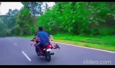 drinking and doing stunts on a bike