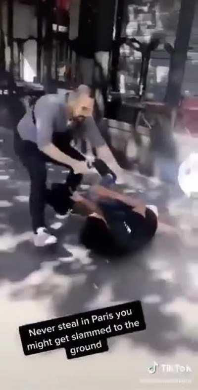 Thief is knocked down to the ground with one hand
