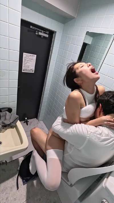 Gorgeous Asian girl draining the manager's cock in the mall washroom.