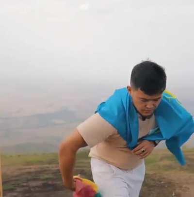 Proud turanic man bravely burns shitty plastic toys for children