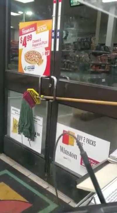 Bear attempts to enter convenience store