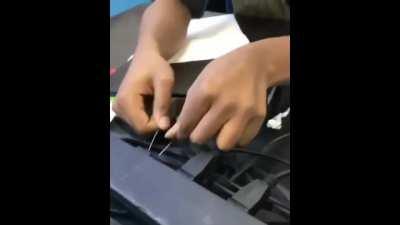 Putting a straightened paperclip in a power outlet