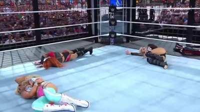 Liv Morgan accidentally caught low by Becky Lynch