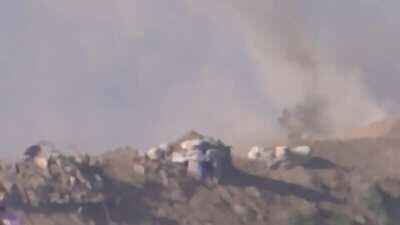 Syrian Army tank firing from behind an elevated berm position is engaged and destroyed by an ATGM - Morek - 5/20/2014
