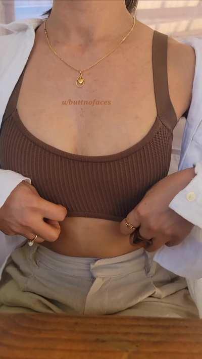 Clothed but adjusting my top 