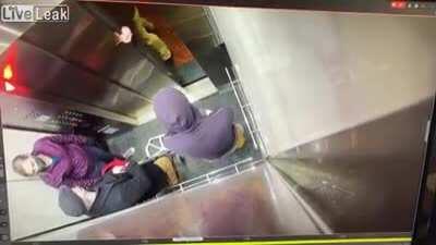 Douche Bag Gets Punched in the Mouth for Coughing on a Woman in an Elevator