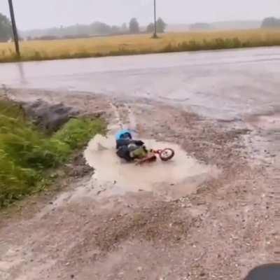 Kid tries to cross puddle and discovers futility of life
