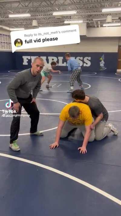 Teaching a wrestling class.