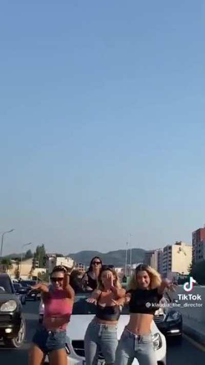 Trash people, blocking very busy street for an ugly ass tiktok video