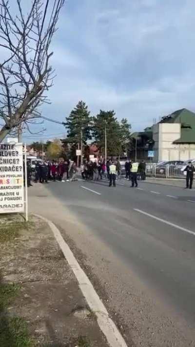We are not blocking the street, officer. We are just crossing it. Repeatedly. - citizen unrest 11/28/2021, Mala Topola, Serbia