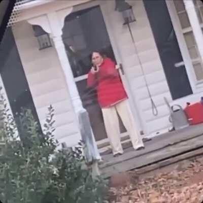 Woman points gun at Amazon delivery driver