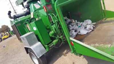 A simulation of what can happen if the tail of a tree climbers rope gets pulled into a woodchipper.