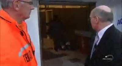 Coach takes out frustration on bag of soccer balls.