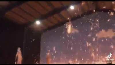 Smacking molten iron with a shovel