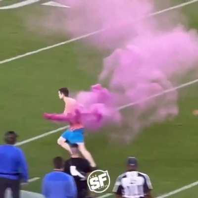 Fan tackled by pro NFL players