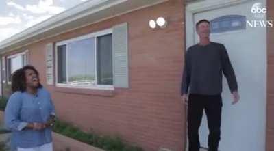 Man removes swastika sign for the friendship between him and a black officer