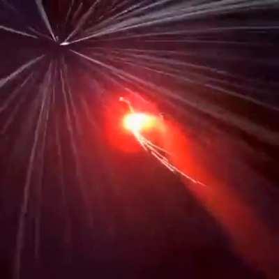 Base jumping off a mountain in the dark while it snows