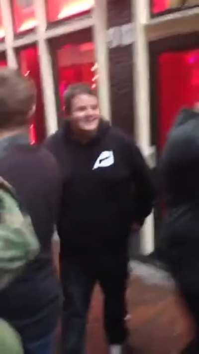 Happy guy after losing virginity to a prostitute in Amsterdam