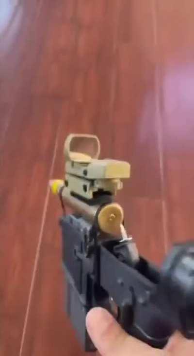 I see your handgun, and I raise you a 20mm AR-15 variant. 