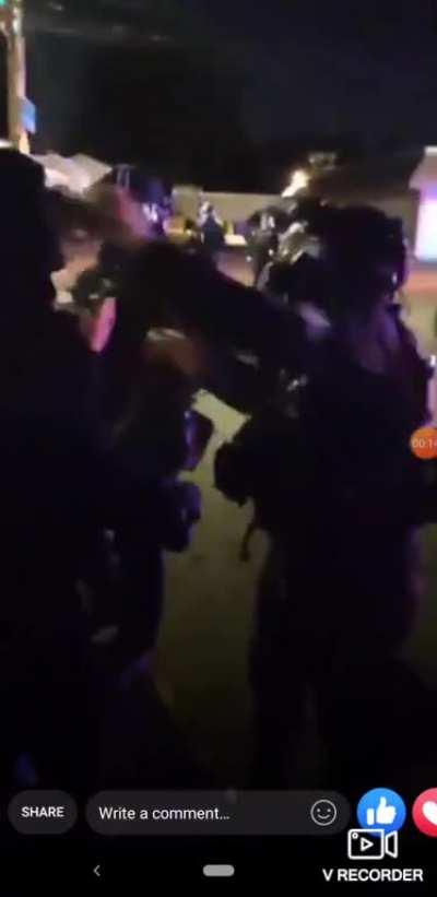 Portland Police Officer rips off the mask of a peaceful protester and pepper sprays them. 7/13/2020