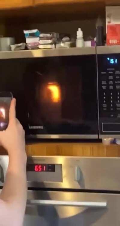 WCGW microwaving a lit match under a glass