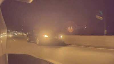 Moves from middle lane to left and proceeds to take an exit without looking. Already has a dent on his car passenger door