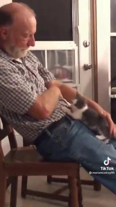 Dad and the cat he never wanted.