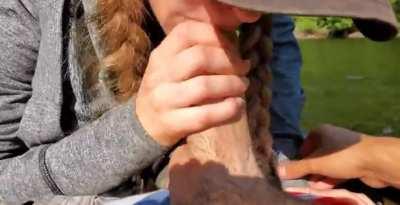 Slut sucks huge cock on the lake