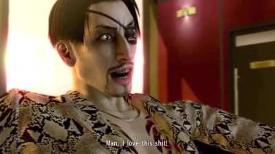 Majima watching his older music video.