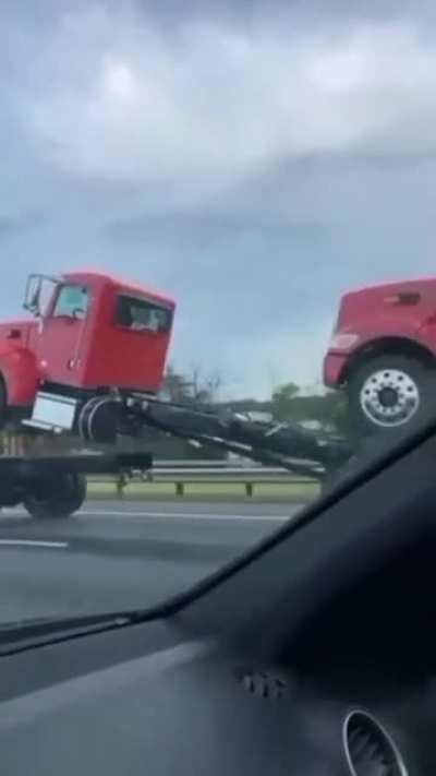 Just a truck carrying a truck- wait a minute....