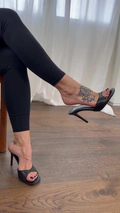 Temptation at its finest - dangling my high heels mules for your pleasure. [F]