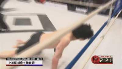 Consistency pays off! Eisaku Ogasawara brutalizes Takuma Ota's legs for the second-round stoppage.