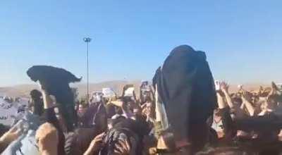 Women of Iran removing their hijabs while screaming 
