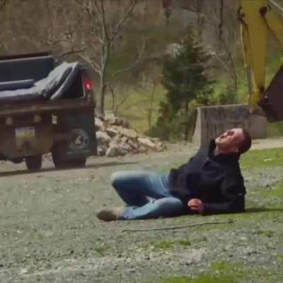 Guy jumped off the roof and tried to land on the back of the moving vehicle