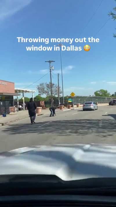 Driver throws money out of the window near a homeless shelter