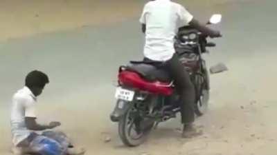 Drunk dude trying to pillion ride on the bike