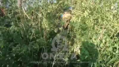 Action camera footage shows Ukrainian soldiers storming a settlement occupied by Russians forces.
