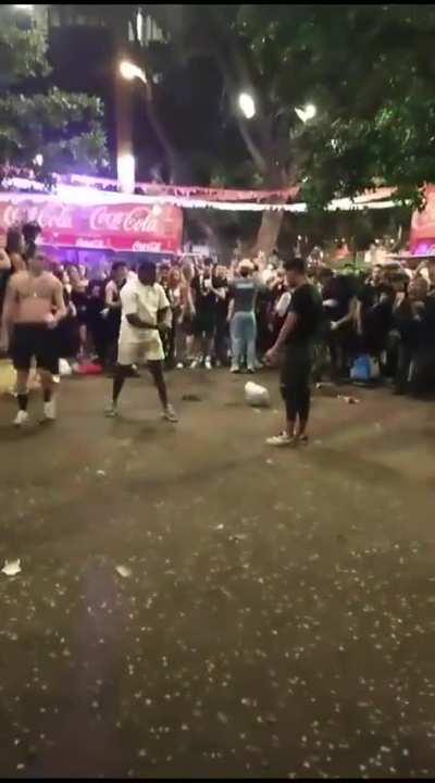 Two dudes were about to fight during a Carnival fair in Tenerife, Spain, when they collectively decided to sort things out differently... And just in time for the cops' arrival too